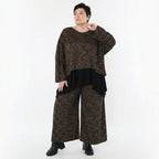Jacquard Überwurf in schwarzcognacorange mit Kringelmuster oversized Rundhals Langarm