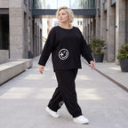 Oversized Hose aus flauschigem French Terry mit Smileydruck und bequem gesmoktem Saum