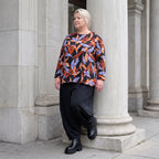 Langarmshirt aus Romanit Jersey in Schwarz/Orange mit Glockenschnitt pflegeleicht weich