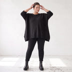 Warmes schwarzes Strickshirt in A-Linie mit Stretch und Destroyedoptik für Winterlooks