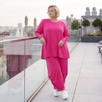Pinkes Langarmshirt in Glockenform aus softer Slinkyqualität mit Rundhalsausschnitt