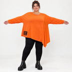 Orange Langarmshirt aus weichem Stretchjersey mit asymmetrischem Schnitt und Zipfelsaum