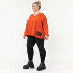 Langarmshirt in Orange aus weichem Stretchjersey mit V-Ausschnitt und kastiger Passform