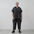 Schwarzweiße karierte Weste in Leinenoptik mit Kapuze Taschen A-Form Vokuhilaschnitt