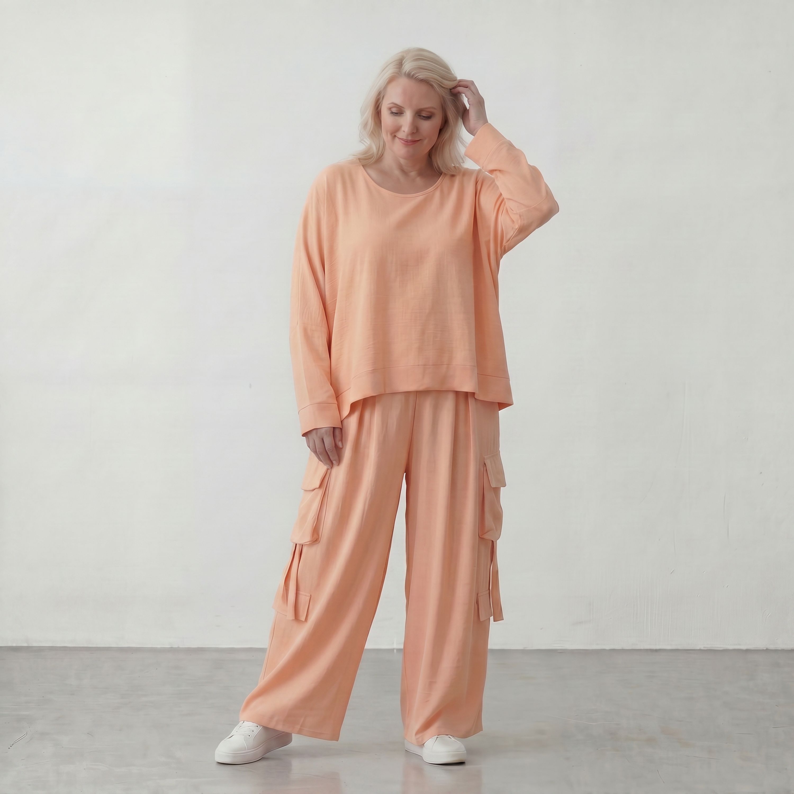 Legere Oversize Ballonhose in fliessendem Mauve mit Lagenlook und Fransen Details Trend