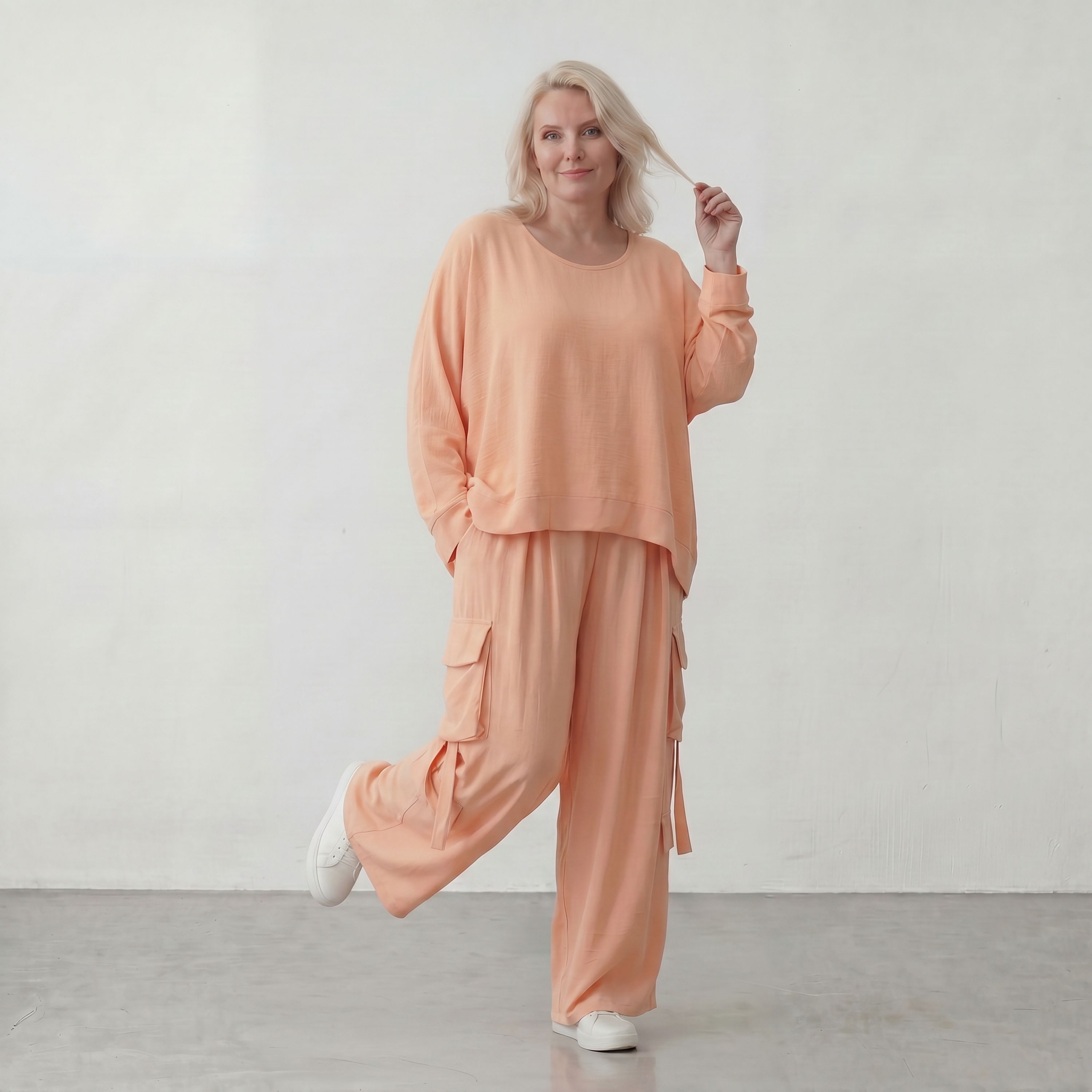 Legere Oversize Ballonhose in fliessendem Mauve mit Lagenlook und Fransen Details Trend